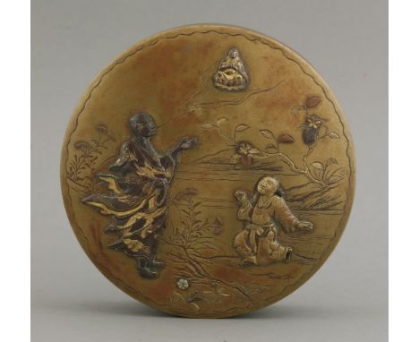 A mixed metal brass Box and Cover, c.1890, the lid applied with a bronze and gilt rakan breathing a figure of Buddha, while a