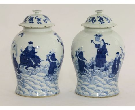 A pair of blue and white baluster Jars and Covers, second half of the 19th century, painted with the Eight Daoist Immortals 