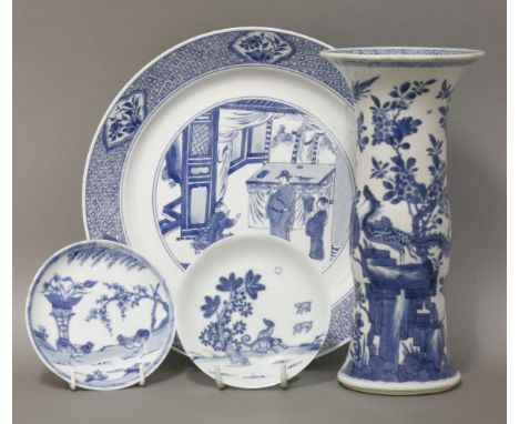 An attractive blue and white large Plate, Kangxi, finely painted in the centre with a literatus and two boys, a table behind 