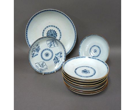 Ten blue and white dishes, late Kangxi, each centred with a stylised peony and within diaper borders and knife cut with lotus