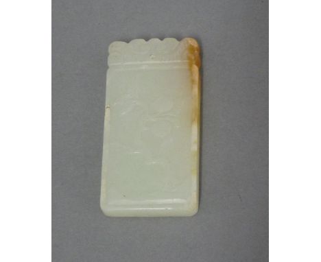 A jade Pendant, second half of 20th century, of rectangular form, carved with two peaches on a branch, the underside with ind