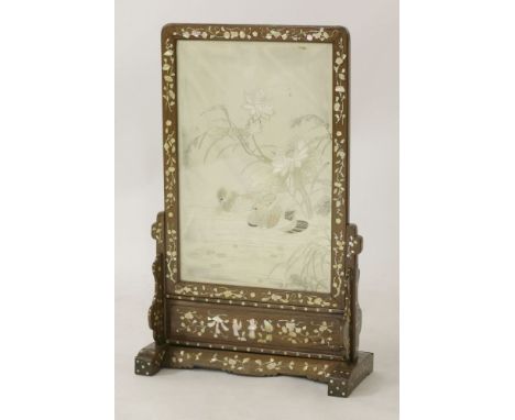 A hardwood Screen, c.1880, the silk-embroidered panel with ducks amongst flowering lilies, the frame profusely inlaid with mo