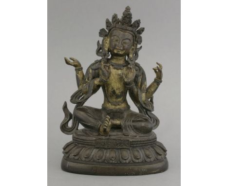 A good Sino-Tibetan bronze, possibly of Vajrasatva, cast Qianlong mark and of the period, the four-armed god parcel gilt and 