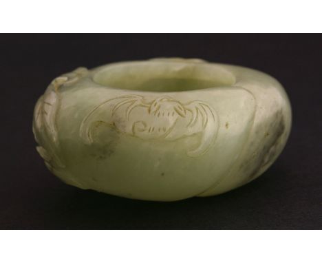 A jade Brush Washer, late Qing, in the form of a peach with a bat and leaves, the stone with grey inclusions, 6.5cm  清末 青玉笔洗