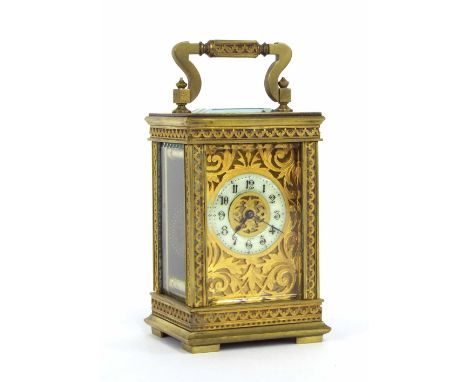 Miniature French carriage clock timepiece, the 1.25" cream chapter ring within a pierced foliate gilt mask and ornate brass c