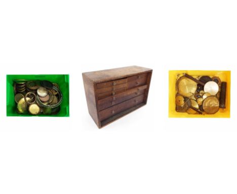 Large quantity of circular clock bezels, doors and pendulums etc; also a small oak eight drawer tool chest, 18" wide