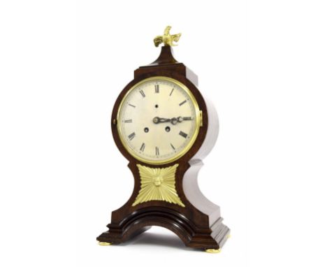 Mahogany two train mantel clock striking on a bell, the 5.25" silvered dial within a balloon shaped stepped case surmounted b