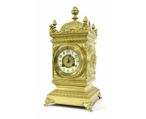 French brass two train mantel clock, the Mougin movement striking on a gong, the 3.25" cream chapter ring enclosing a gilded 
