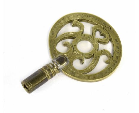 Antique brass bracket clock key, the engraved oval handle pierced with a heart and foliate scrolls, 2.5" high