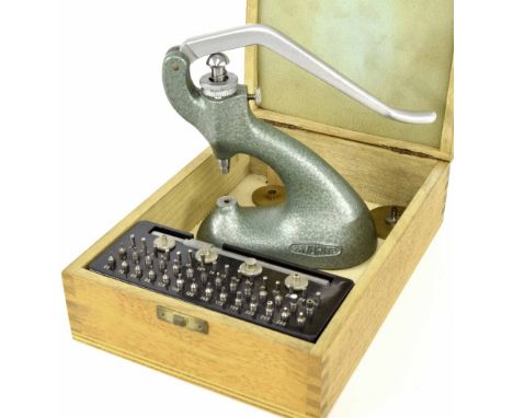 Favorite jewelling tool and accessories, within a fitted pale wooden rectangular box