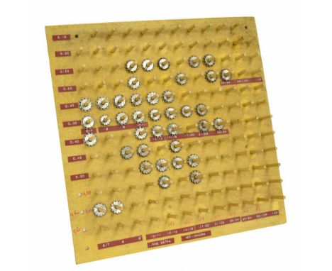 Over forty clock wheel cutters, held on spindles fixed to a square wooden board