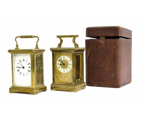 Ornate carriage clock timepiece, the 1.75" cream chapter ring within a foliate engraved mask and brass case, 6" high; also an