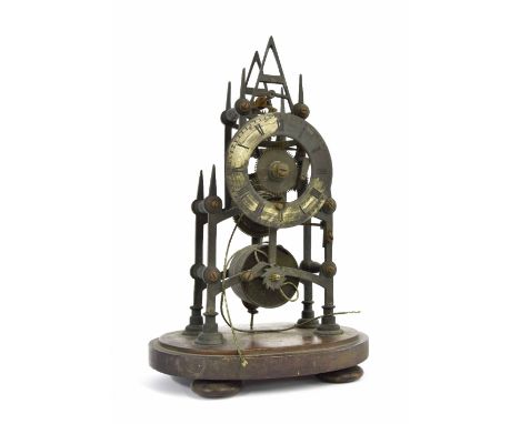 Brass single fusee skeleton clock, the 4" silvered dial and movement upon arched supports, circular stepped feet and a mahoga