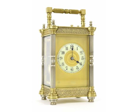 Large French repeater carriage clock striking on a gong, the 2.25" cream dial within a gilt mask and ornate pillared case wit
