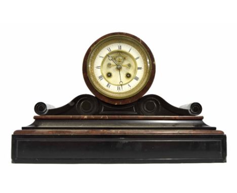 Small black slate and red marble two train mantel clock with visible escapement and striking on a bell (key, but no pendulum)