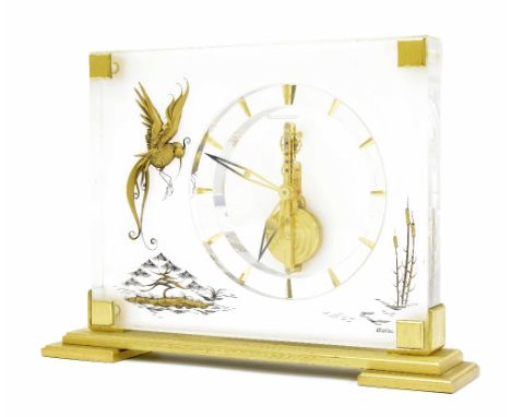 Good Jaeger LeCoultre decorative table clock, with visible eight day movement, gilt engraved 'Bird of Paradise' motif on Plex