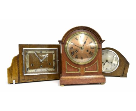 Mahogany two train mantel clock, the 6" silvered dial within a rounded arched stepped case, 14.5" high; also two Art Deco sty