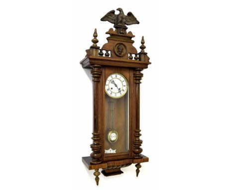 Small walnut Vienna two train regulator wall clock, the 5" white dial within a glazed and turned pillared case, 42" high (pen