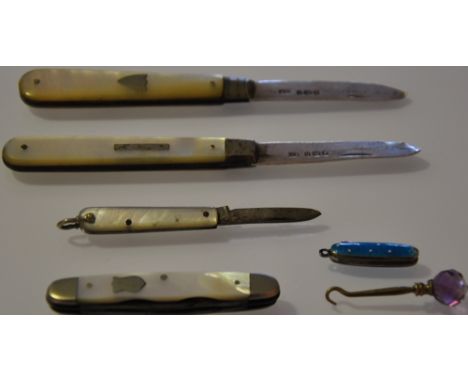 Two Victorian silver bladed mother of pearl fruit knives, a steel and mother of pearl pen knife, two miniature pen knives and