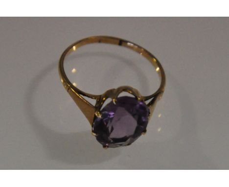 A 9ct gold vintage amethyst ring with oval claw set stone