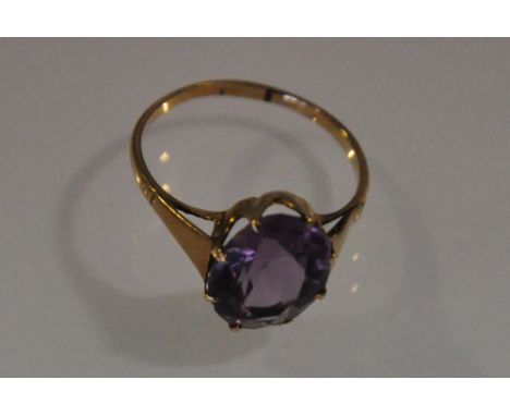 A 9ct gold vintage amethyst ring with oval claw set stone