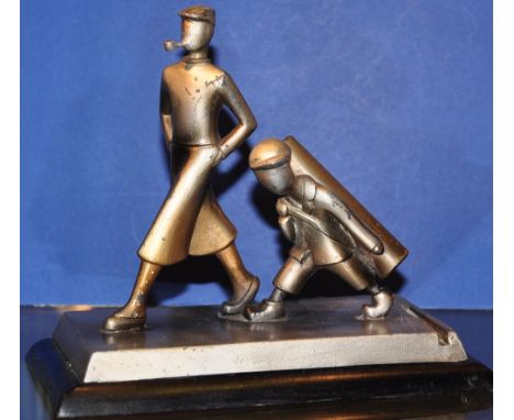 An unusual 1950s cold painted spelter table lighter modelled as a golfer and caddy