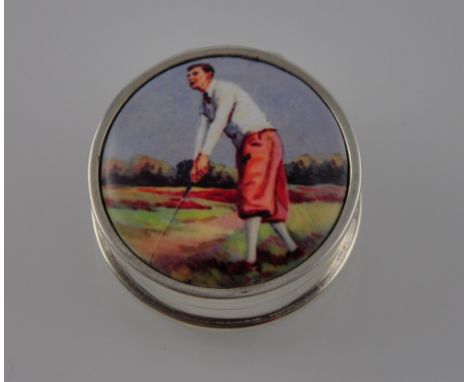 A silver box with a round vintage picture of a golfer on the lid