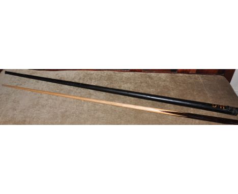 A vintage snooker cue in a painted tin tube case