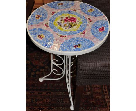 A pair of wrought iron and mosaic tile top bistro tables