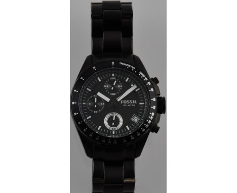 A Fossil black steel gentlemans chronograph wristwatch with triple subsiduary dials, bracelet strap