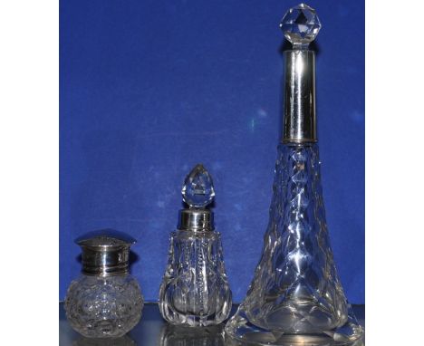 An antique silver mounted perfume bottle London 1909, an antique cut glass scent bottle with hallmarked silver collar togethe