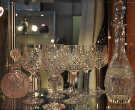 A near pair of Victorian glass condiment bottles and stoppers with etched fern bodies together with seven cut glass wines, a 