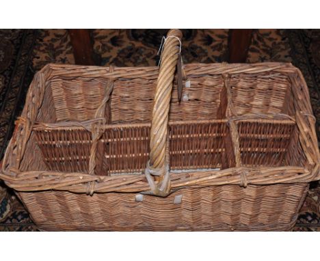 A vintage French cane eight division olive basket. L: 64cm