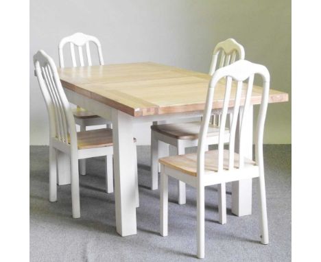 A white painted light oak dining table, with two additional leaves, together with a set of four dining chairs (5)192l x 92d x