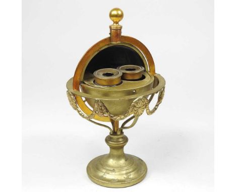 A 19th century gilt metal novelty inkwell, in the form of a globe on stand, with a hinged lid, 21cm high