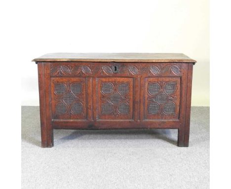 An 18th century carved oak coffer, with a hinged lid115w x 49d x 65h cm