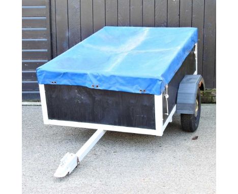 A single axle car trailer, with tarpaulin cover, 130cm wide230w x 140d x 85h cmIt looks to have been completely restored and 