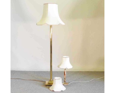 A brass standard lamp and shade, together with a similar table lamp (2)