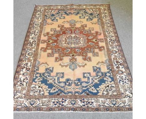 A Persian rug, with hooked designs, 200 x 130cm