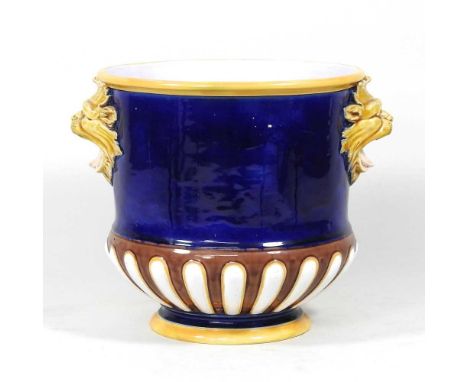 A 19th century Mintons majolica blue glazed jardiniere, flanked by lion masks, impressed marks and shape number 806, 20cm hig