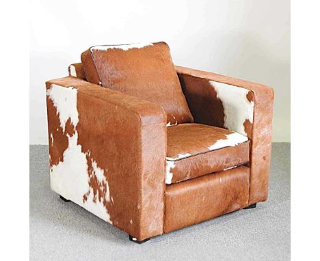 An Art Deco style armchair, upholstered in cow hide, by Joris86w x 89d x 89h cmOverall condition is complete and usable. Ligh