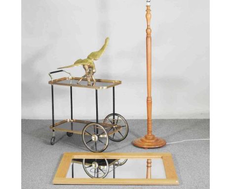 A vintage brass trolley, together with a modern light oak mirror, a floor lamp and a brass eagle (4)