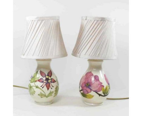A Moorcroft pottery table lamp and shade, together with another similar (2)