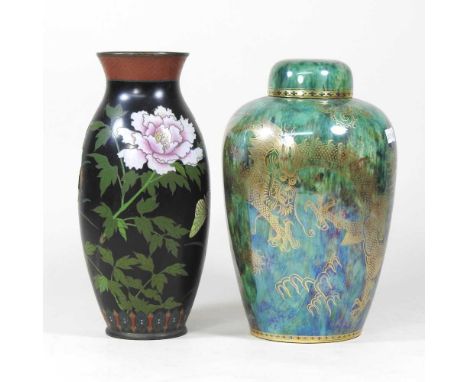 A Wedgwood lustre ginger jar and cover, circa 1920, decorated with gilt dragons, on a mottled green ground, printed marks and