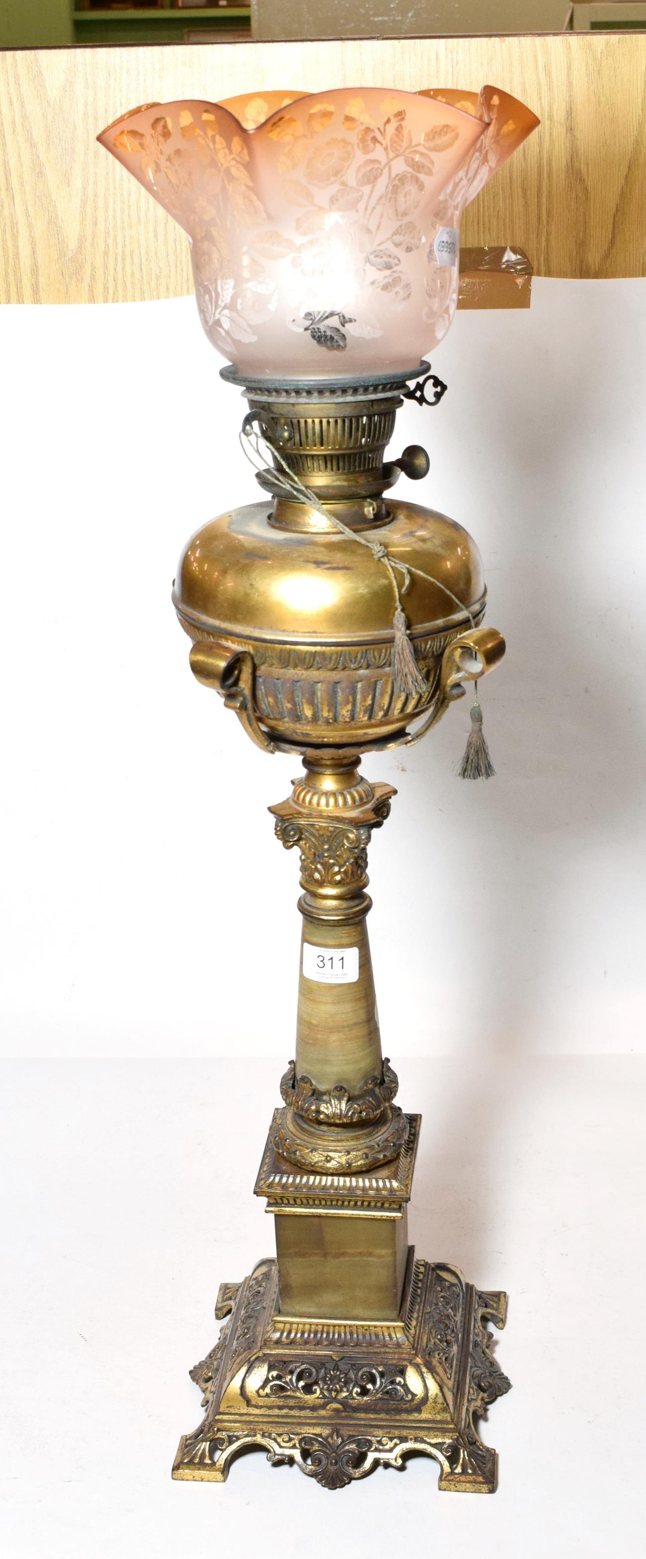 An impressive Victorian brass oil lamp with etched shade with three