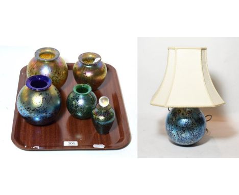 Four Isle of Wight iridescent glass vases; a scent bottle and stopper; a similar table lamp and shade (6)