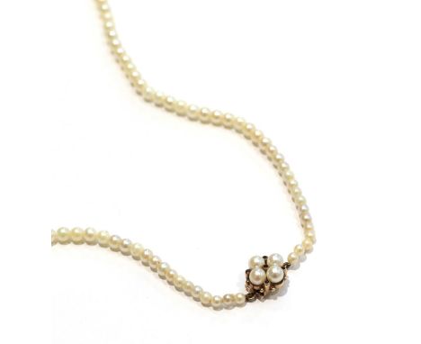 A graduated cultured pearl necklace with a 9 carat gold garnet and cultured pearl cluster snap, length 78cm 
