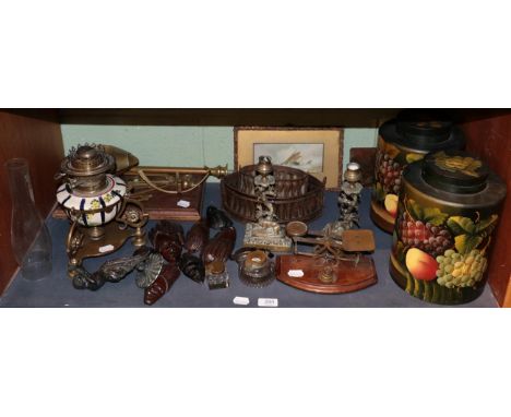 A pair of brass and mahogany beam scales by Avery; a small pair of postal scales; an oil lamp; a pair of fruit painted papier