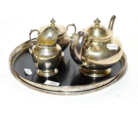 A sterling silver Gorham tray, and a composite three piece sterling silver S Kirk and Son tea service