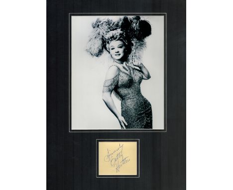 Betty Hutton signature piece mounted below black and white photo. Approx overall size 16x12inch. Good condition. All autograp